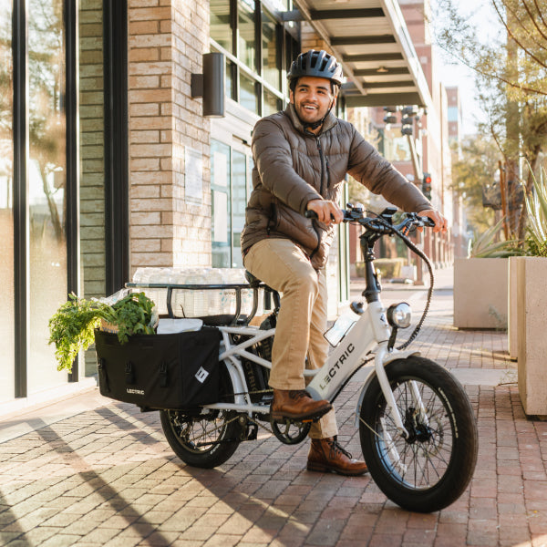 riding lectric ebike in city with groceries